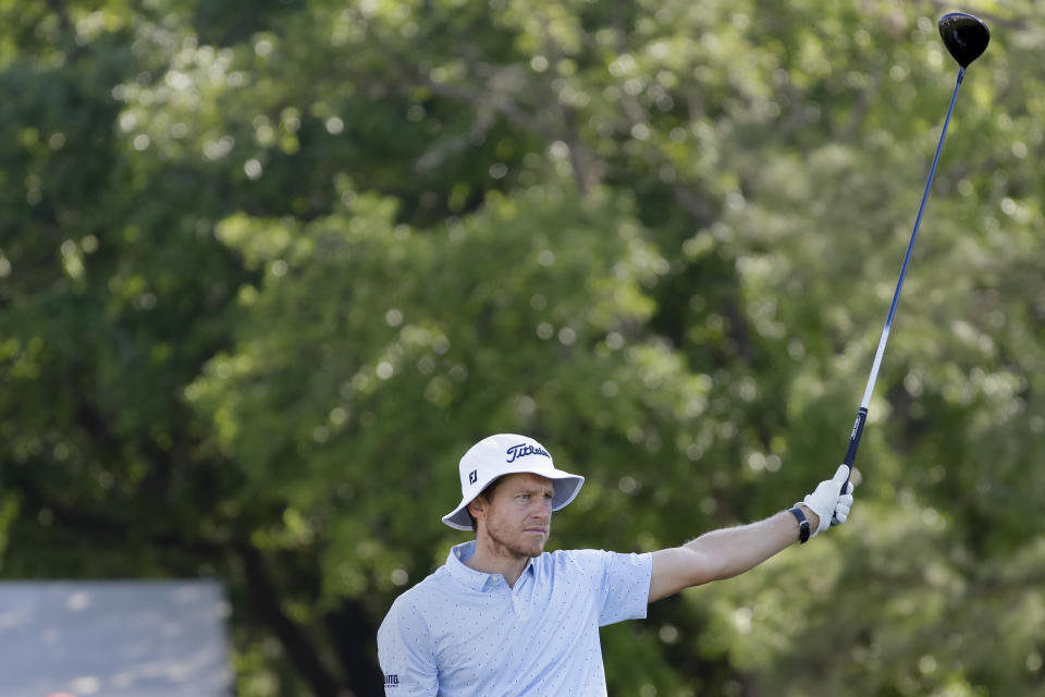 Peter Malnati reacts as he watches his tee shot on the first hole during the first round of the Houston Open golf tournament Thursday, March, 28, 2024, in Houston. (AP Photo/Michael Wyke)