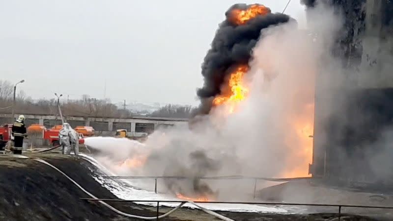 A still image shows a fuel depot on fire in Belgorod