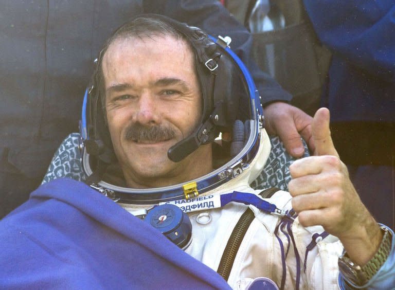 Canadian spaceman Chris Hadfield touches down aboard the Russian Soyuz space capsule in Kazakhstan on May 14, 2013. Hadfield returned to Earth along with two other astronauts after a half-year mission to the International Space Station that saw him shoot to global stardom through his Twitter microblog