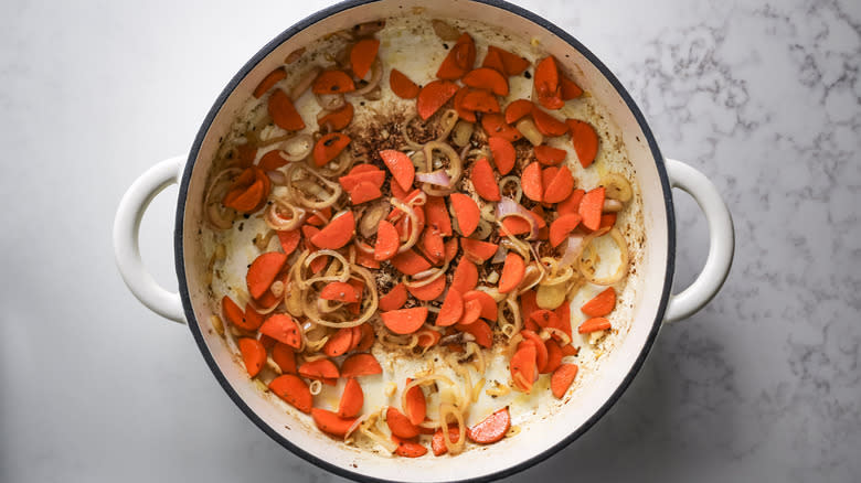 carrots and shallots in Dutch oven