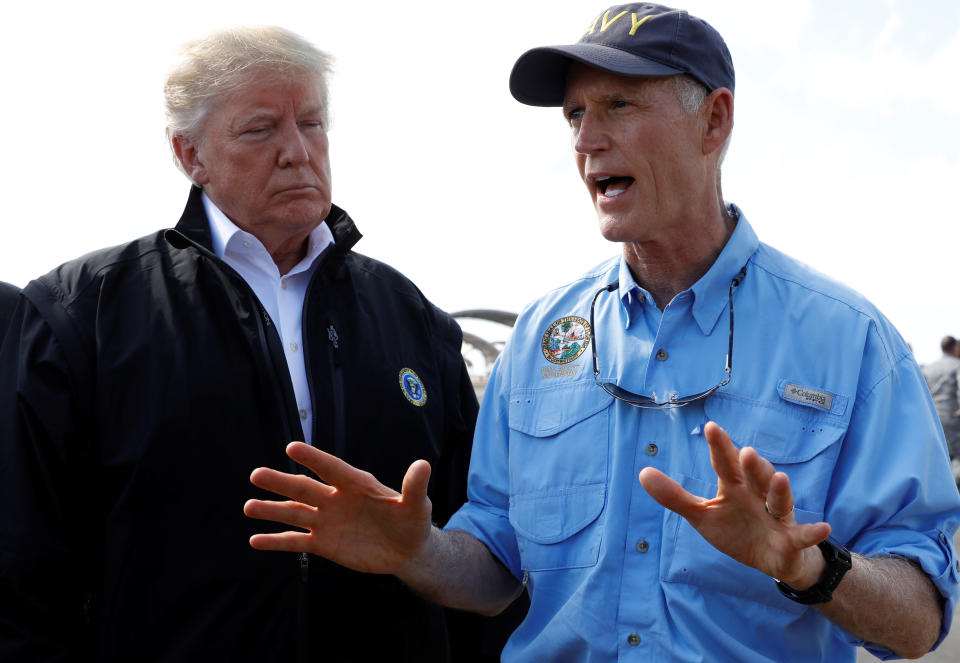 President Trump and Fla. Gov. Rick Scott at Eglin Air Force Base after the president arrived to tour Hurricane Michael storm damage on Oct. 15, 2018. (Photo: Kevin Lamarque/Reuters)