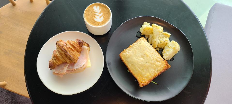 Halfmoon's cappucino, croque monsiuer, croissant with ham and cheese.