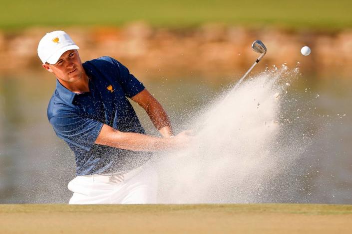 Jordan Spieth hits from the bunker onto the fourteenth green during the fourth session of the Presidents Cup at Quail Hollow Club in Charlotte, N.C., Saturday, Sept. 24, 2022. 