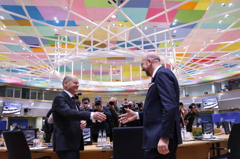 German Chancellor Olaf Scholz (L) and President of the European Council Charles Michel attend the special meeting of the European Council in Brussels.  Dario Pignatelli v European Council/dpa