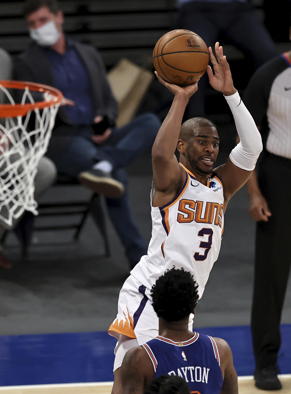 Phoenix Suns' Chris Paul (3) shoots as New York Knicks' Elfrid Payton defends in the third quarter of an NBA basketball game Monday, April 26, 2021, in New York. (Elsa/Pool Photo via AP)