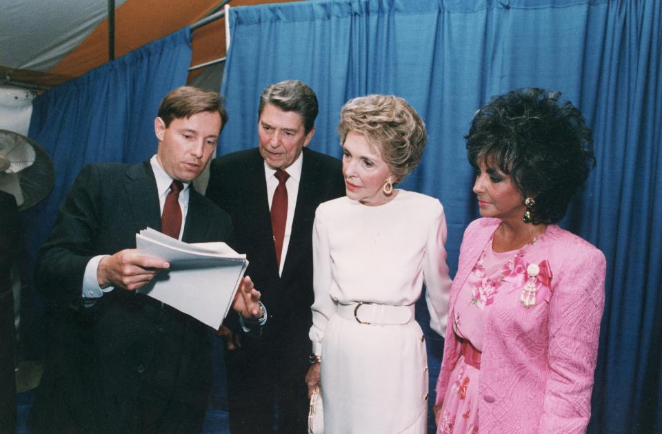 Elizabeth Taylor with Ronald Reagan and First Lady Nancy Reagan in 1987 as Reagan prepared to give a speech on the AIDS crisis. The president was booed at points for what some saw a lack of sensitivity for those who had contracted the virus.