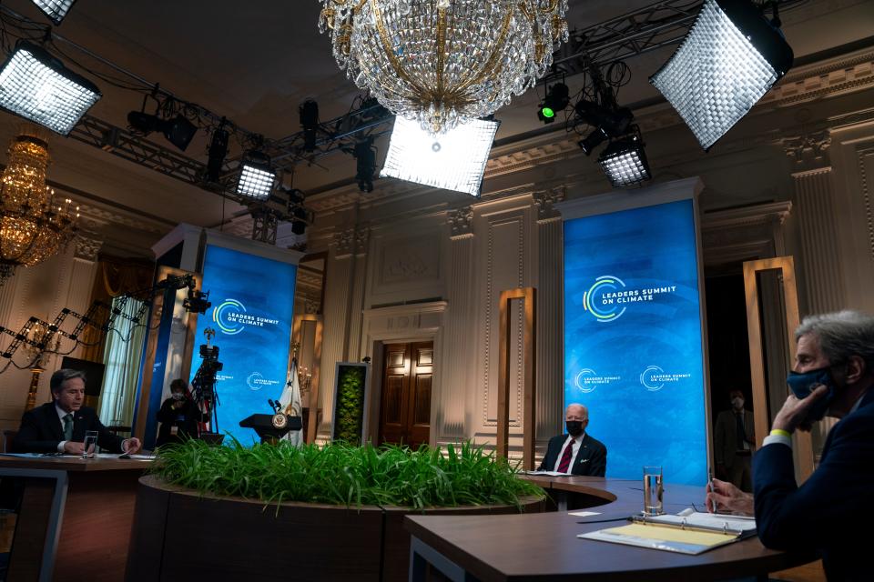 Secretary of State Antony Blinken, President Joe Biden, and Special Presidential Envoy for Climate John Kerry listen during a virtual Leaders Summit on Climate, from the East Room of the White House on Earth Day, April 22 (AP)