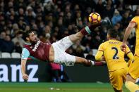 West Ham United's striker Andy Carroll shoots to score with this bicycle kick against Crystal Palace at The London Stadium, in east London on January 14, 2017