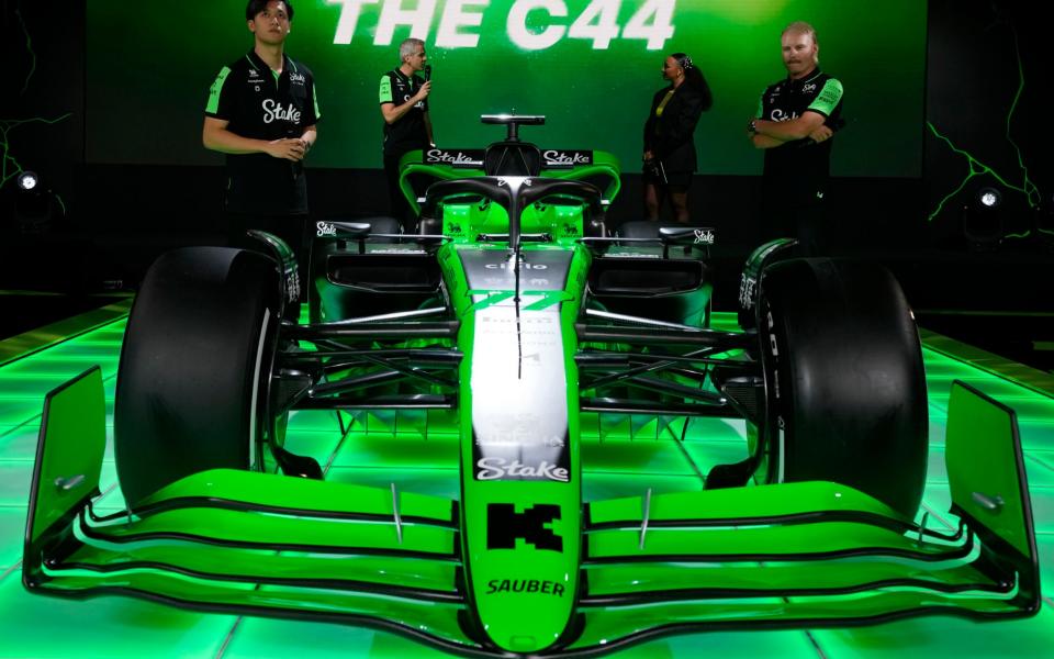 Stake F1 Team Kick Sauber's Zhou Guanyu, left, and teammate Valtteri Bottas watch the Formula One car race 2024 Kick Sauber C44 car during the launch in London on Monday, February 5, 2024