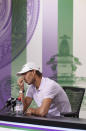 Spain’s Rafael Nadal announces that he is withdrawing from the men’s singles semifinal match at the Wimbledon tennis championships, in London, Thursday, July 7, 2022. Rafael Nadal withdrew from Wimbledon on Thursday because of a torn abdominal muscle, announcing his decision a day before he was supposed to play in the semifinals. (Joe Toth/Pool Photo via AP)