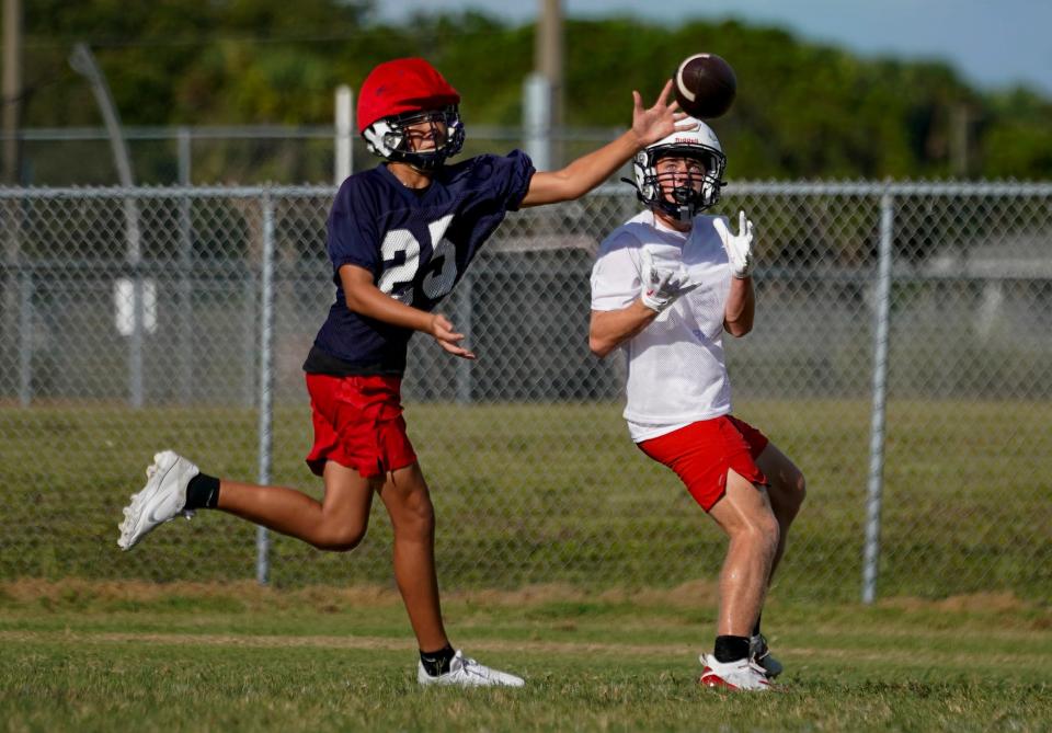 Football players take part in practice at Estero High School on Tuesday, Aug. 1, 2023. (Syndication: Naples Daily News)