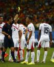 Referee Ravshan Irmatov of Uzbekistan shows the yellow card to Costa Rica's Junior Diaz (15) after a foul on Arjen Robben of the Netherlands during their 2014 World Cup quarter-finals at the Fonte Nova arena in Salvador July 5, 2014. REUTERS/Michael Dalder