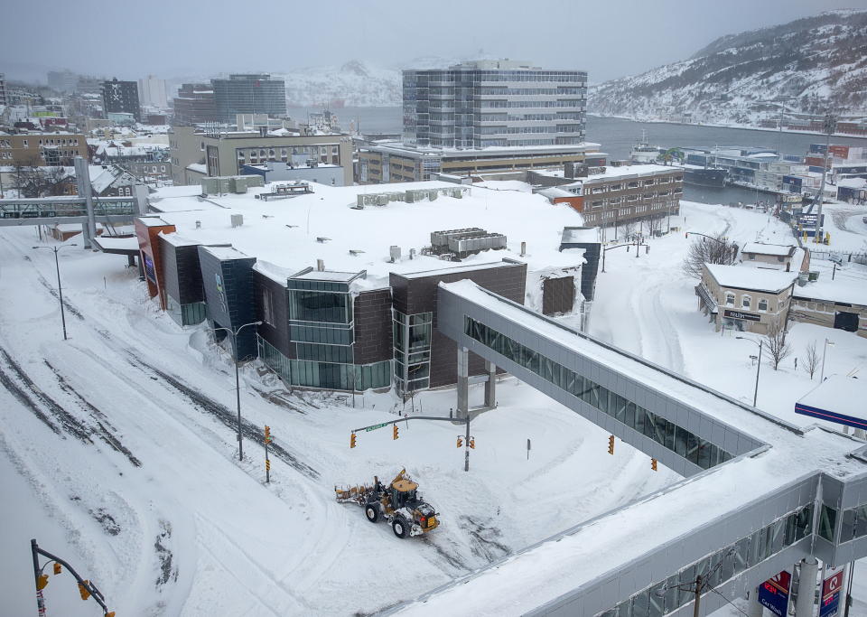 A snowplow clears the road in St. John's St. John's Newfoundland on Saturday, Jan. 18, 2020. The state of emergency ordered by the City of St. John's is still in place, leaving businesses closed and vehicles off the roads in the aftermath of the major winter storm that hit the Newfoundland and Labrador capital. (Andrew Vaughan/The Canadian Press via AP)