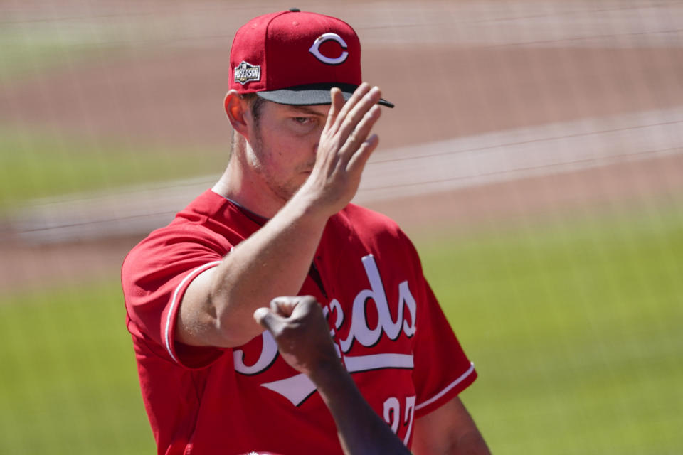 Cincinnati Reds starting pitcher Trevor Bauer (27) leaves the game in the eighth against the Atlanta Braves during Game 1 of a National League wild-card baseball series, Wednesday, Sept. 30, 2020, in Atlanta. (AP Photo/John Bazemore)