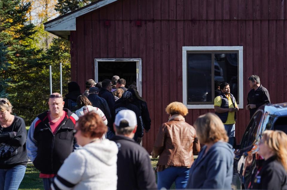 UAW Local 598 members go in to cast their ratification vote in the UAW and General Motors national agreement at the Union City Fields in Flint on Wednesday, October 23, 2019.