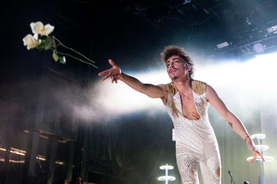 Greta Van Fleet lead singer Josh Kiszka throws roses out to fans while performing at Beale Street Music Festival on May 6 at Tom Lee Park in Downtown Memphis, Tenn.