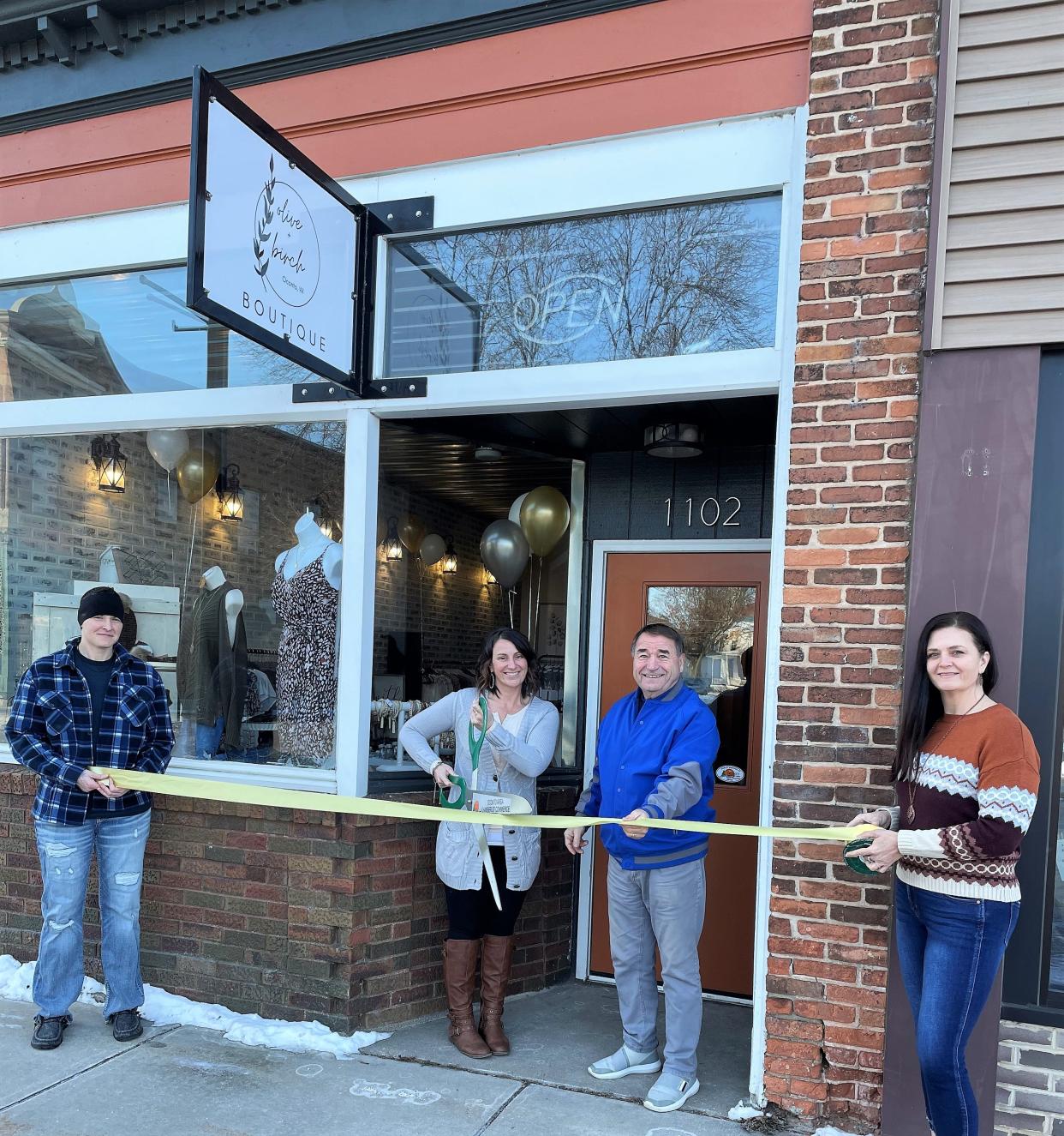 Magan Holz cuts the ribbon at the grand opening of her downtown Oconto store, Olive + Birch, earlier this month. From left are Jen Clements, owner of Inspire Fitness Gym, Holz, Oconto Area Chamber of Commerce president Rob Hayes and Sandy Wenzel, a friend of Holz’s.