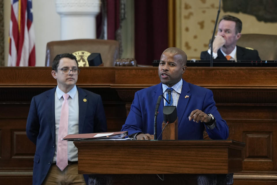 Texas state Rep. Briscoe Cain, R-Baytown, left, listens as Rep. Ron Reynolds, D-Moissouri City, right, debates a voting bill at the Texas Capitol in Austin, Texas, Tuesday, May 23, 2023. (AP Photo/Eric Gay)