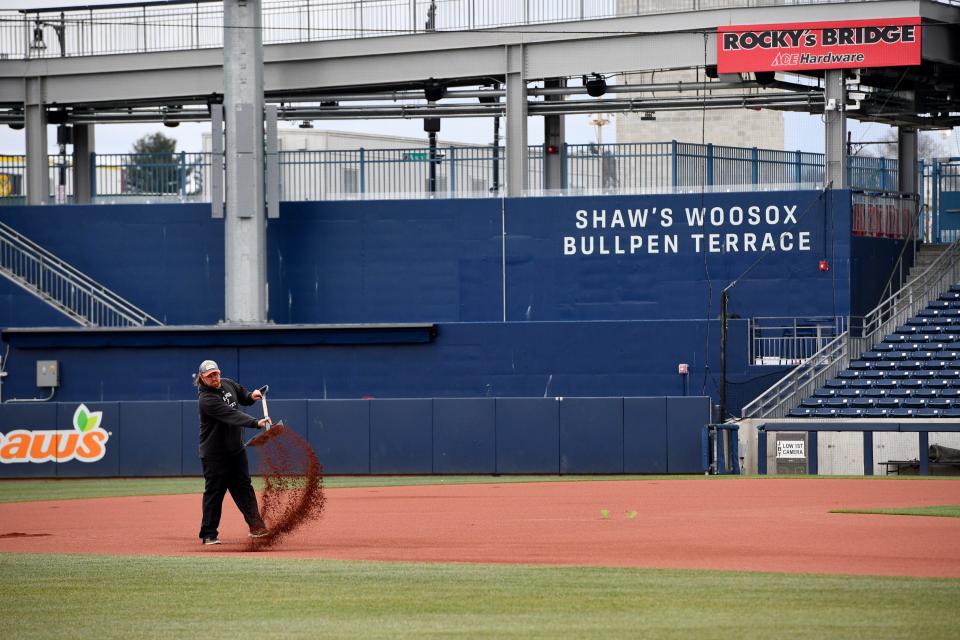 The infield gets fresh sand as grounds crew get ready on Tuesday for opening day on Friday.