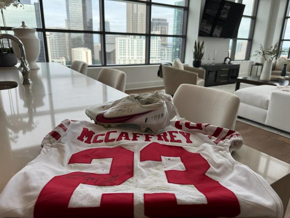 Christian McCaffrey gave his jersey and cleats to a family moving into his former penthouse in Uptown Charlotte