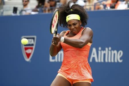 Sep 2, 2015; New York, NY, USA; Serena Williams of the United States hits a backhand against Kiki Bertens of the Netherlands (not pictured) on day three of the 2015 U.S. Open tennis tournament at USTA Billie Jean King National Tennis Center. Williams won 7-6 (5), 6-3. Mandatory Credit: Geoff Burke-USA TODAY Sports