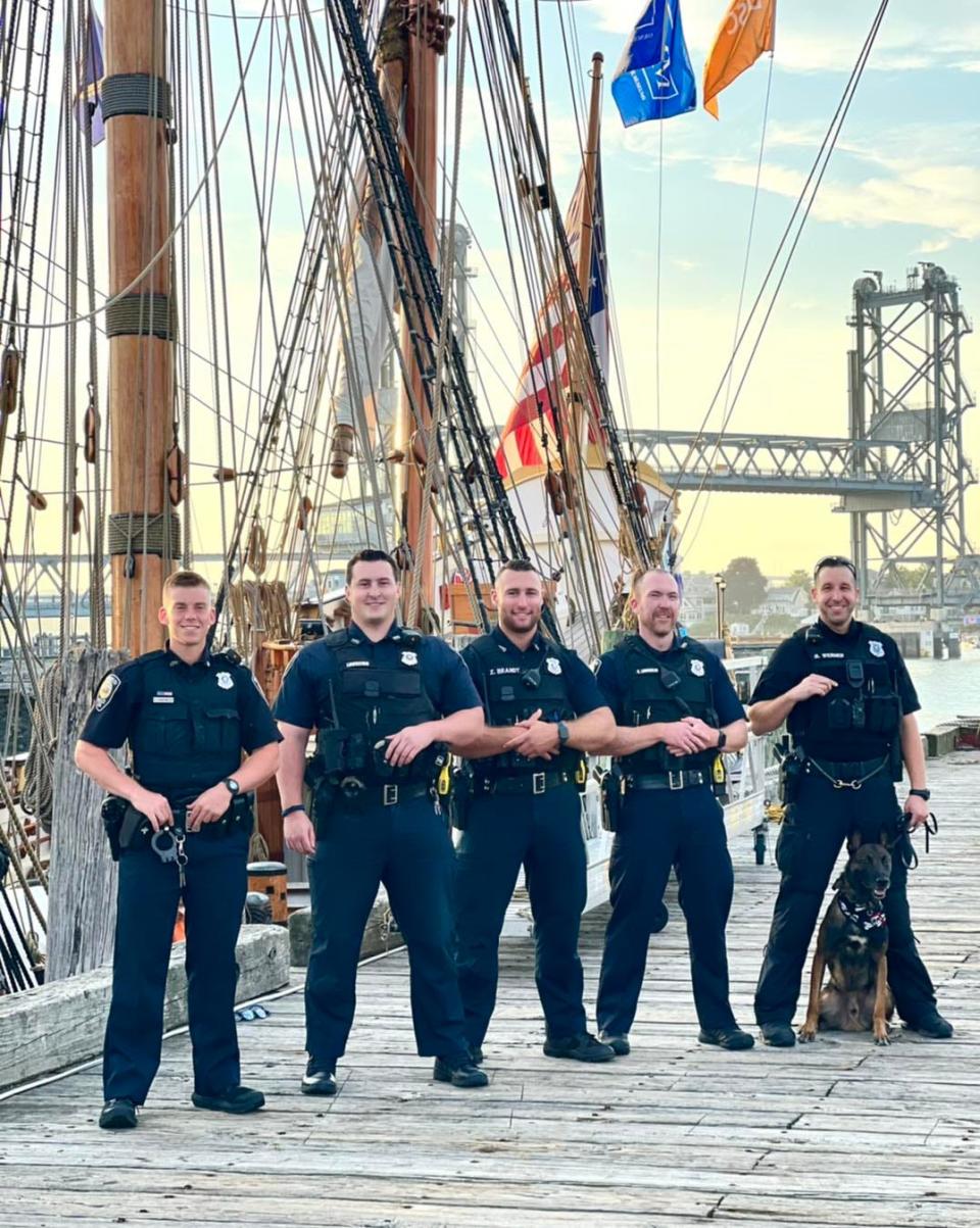 Portsmouth police officers working at the tall ships dock are, from left, Blaine Johnson, Matt Loureiro, Zach Brandt, Conall Loughlin and K9 officer Bill Werner.