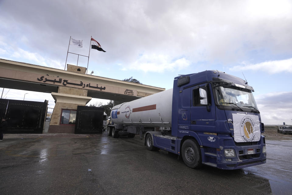 An Egyptian truck delivering fuel to the Gaza Strip, crosses from Gaza to Egypt at Rafah, Egypt, as a temporary ceasefire went into effect, Monday, Nov. 27, 2023. (AP Photo/Amr Nabil)