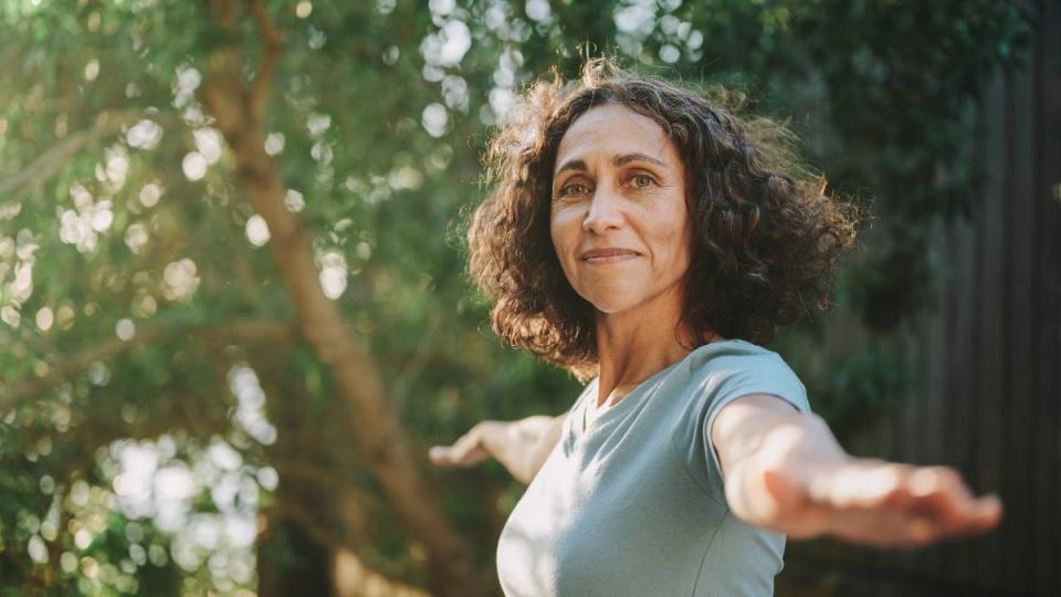 Woman doing a daily stretching routing outside