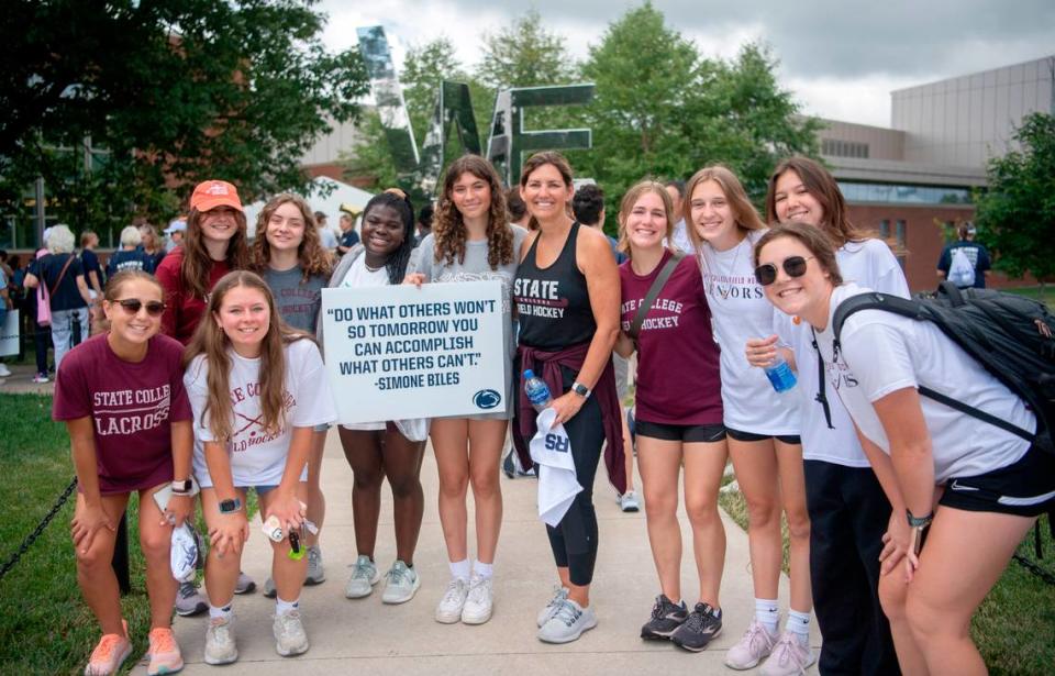 Teammates from State College field hockey team for a photo before the “Roar and Rally” walk to celebrate the 50th Anniversary of Title IX on Thursday, June 23, 2022.