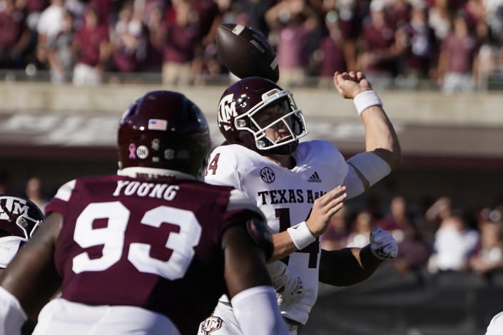 Texas A&M quarterback Max Johnson is hit from behind by a Mississippi State defender and looses the ball during the first half of an NCAA college football game in Starkville, Miss., Saturday, Oct. 1, 2022. (AP Photo/Rogelio V. Solis)