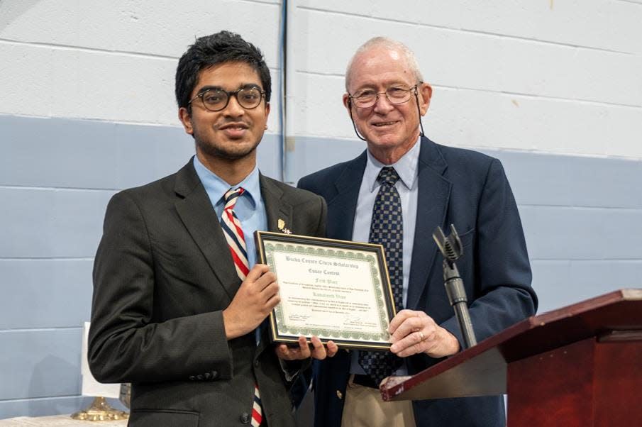 Dick Newbert, right, of theLegacyof1776.com presents Kamaljeeth Vijay, a senior at Holy Ghost Prep, with a certificate acknowledging his first-place essay in a civics essay contest.