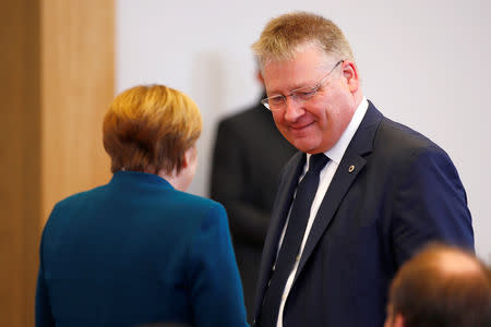 German Chancellor Angela Merkel and the President of the German Federal Intelligence Agency (BND) Bruno Kahl attend the opening ceremony of the new BND (Federal Intelligence Service) headquarter in Berlin, Germany, February 8, 2019. REUTERS/Axel Schmidt