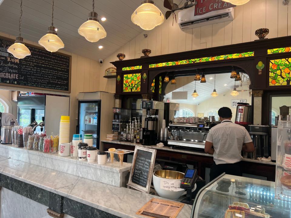 The back counter with its stained glass at Boops by the Bubble Room is from 1906