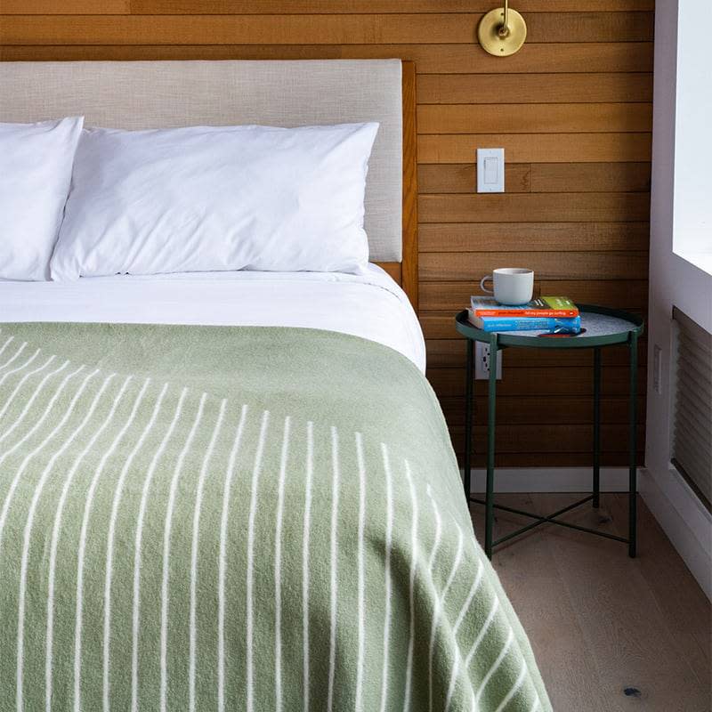 Rumpl merino softwool blanket on cabin bed