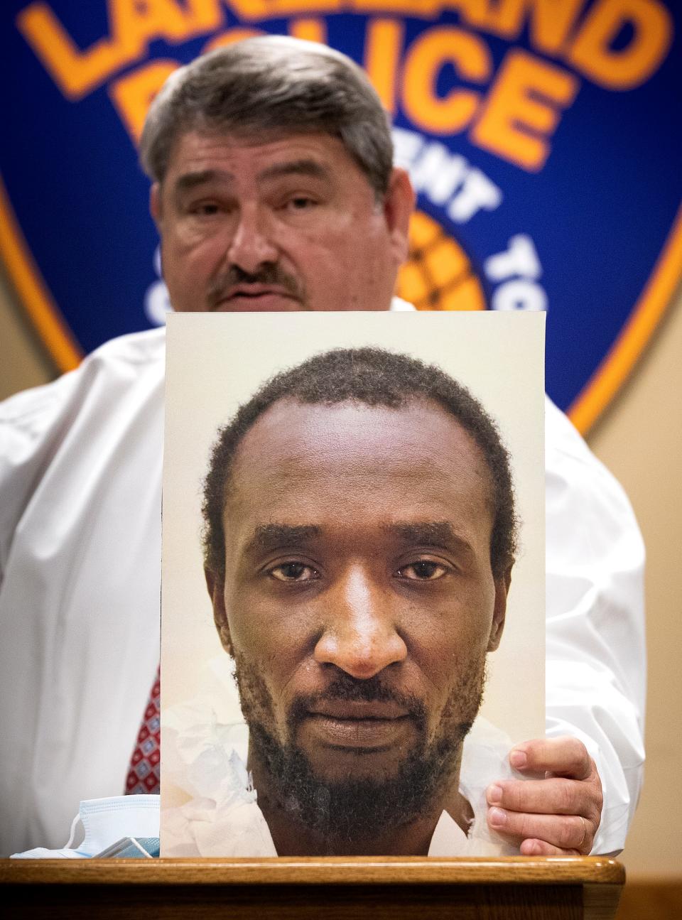 Lakeland Assistant Chief Of Police Sam Taylor holds up a photo of Marcelle Waldon, who was arrested and charged with 10 felony counts in the murder of Edith Henderson and her husband David Henderson, during a press conference at Lakeland Police Department headquarters on Nov. 12, 2020. Former City Commissioner Edith Henderson, also known as Edie Yates, 67, and her husband David Henderson, 64, were found dead in their home on Lake Morton.