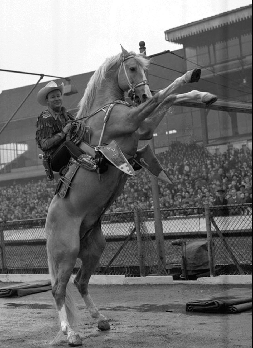 Roy Rogers rides his famous horse Trigger in this 1954 file photo taken in London. Rogers, the singing “King of the Cowboys” whose straight-shooting exploits in movies and television made him a hero to generations of young fans and No. 1 at the box office, died July 6, 1998. He was 86.