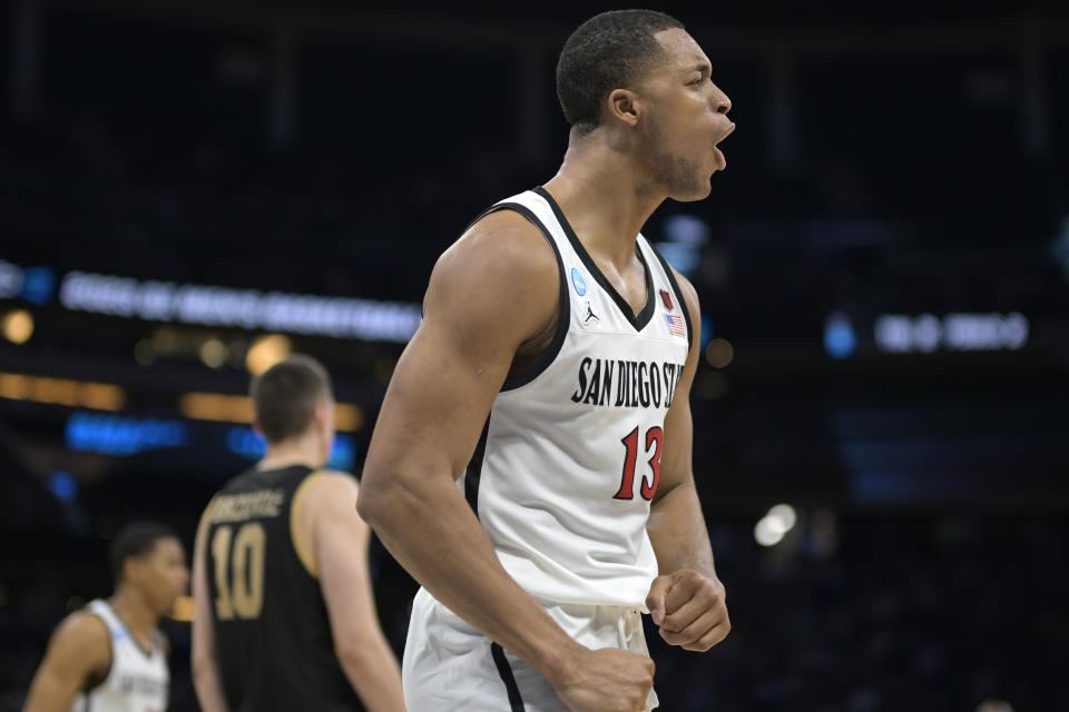San Diego State forward Jaedon LeDee (13) celebrates after a play during the second half of a first-round college basketball game against Charleston in the NCAA Tournament, Thursday, March 16, 2023, in Orlando, Fla. (AP Photo/Phelan M. Ebenhack)