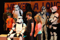 SYDNEY, AUSTRALIA - APRIL 11: Jacob French talks to patients after completing his trek at the Sydney Children's Hostpital on April 4, 2012 in Sydney, Australia. French today completed the over 5,000 km trek from Perth to Sydney on foot, donning a full body stormtrooper costume he successfully raised over $100,000 for the Starlight Children's Foundation. Since July 2011, Jacob has walked 10 hours a day, Monday to Friday, lost over 12kg in weight, and gone through seven pairs of shoes. The Starlight Children's Foundation provides programs to help lift the spirits of sick children in hospitals accross Australia. (Photo by Cameron Spencer/Getty Images)