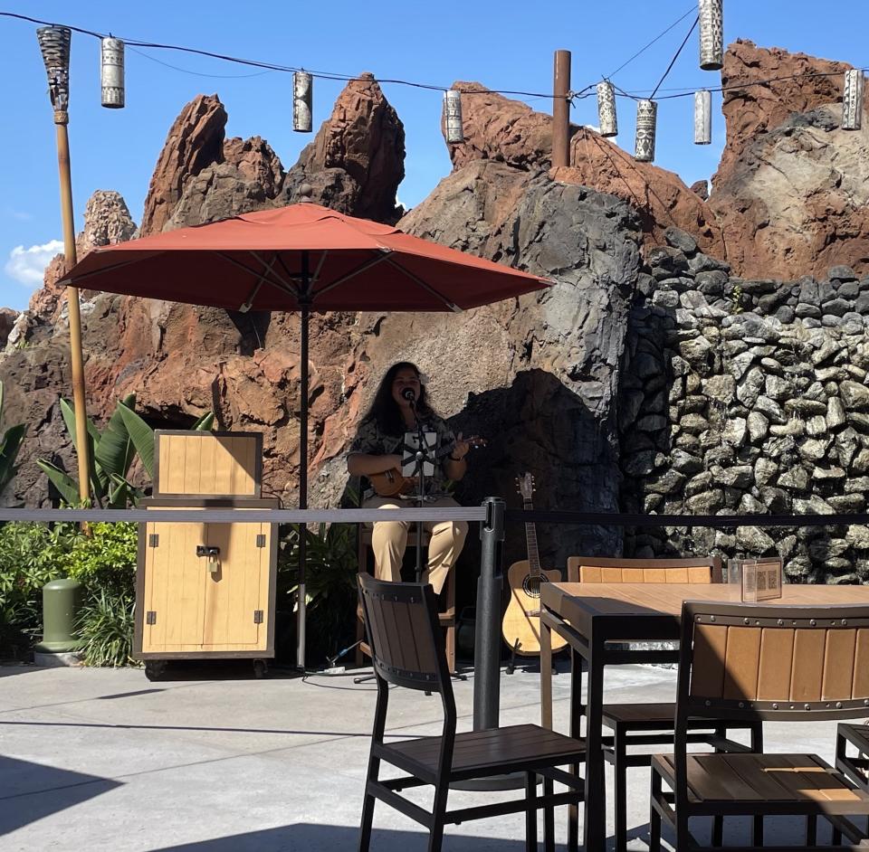 Against the background of a waterfall, talented cast members play ukulele while singing along to soft Hawaiian music. Trader Sam's Terrace even has the same menu as the Grog Grotto inside (and no reservations are required).