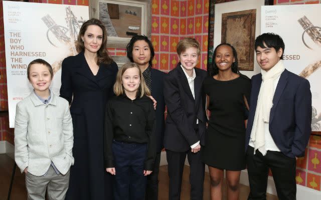 Angelina Jolie with children Knox Leon Jolie-Pitt, Vivienne Marcheline Jolie-Pitt, Pax Thien Jolie-Pitt, Shiloh Nouvel Jolie-Pitt, Zahara Marley Jolie-Pitt and Maddox Chivan Jolie-Pitt. Photo by Monica Schipper/Getty Images for Netflix.