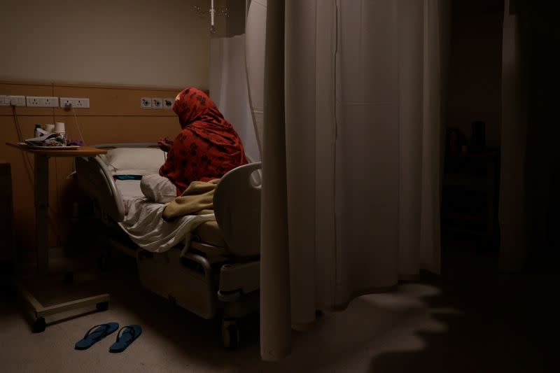 Medical workers treat patients infected with the coronavirus disease (COVID-19) at a hospital in New Delhi