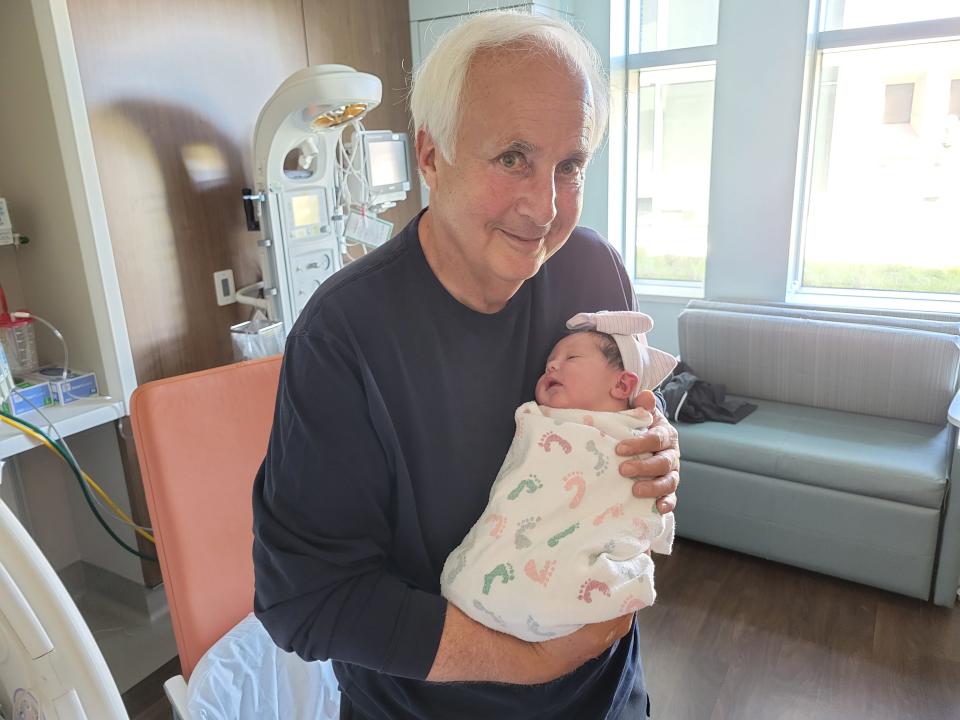 Peter Funt with his granddaughter, Emily, less than two hours after her birth in San Francisco.