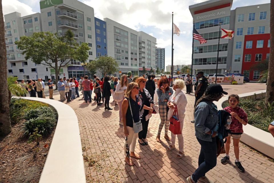 A crowd gathers to attend a school board meeting in Orlando, Florida, amid protests over book banning and LGBTQ rights.