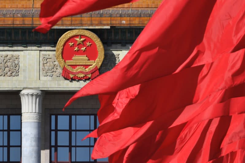 FILE PHOTO: Red flags flutter outside the Great Hall of the People during the closing session of the Chinese People's Political Consultative Conference (CPPCC) in Beijing