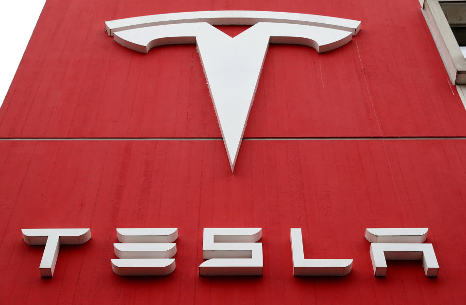 The logo of car manufacturer Tesla is seen at a branch office in Bern, Switzerland October 28, 2020. Picture taken October 28, 2020.  REUTERS/Arnd Wiegmann