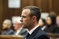 South African Olympic and Paralympic athlete Oscar Pistorius looks on during his murder trial in the North Gauteng High Court in Pretoria, April 16, 2014. Pistorius is on trial for murdering his girlfriend Reeva Steenkamp at his suburban Pretoria home on Valentine's Day last year. REUTERS/Gianluigi Guercia/Pool (SOUTH AFRICA - Tags: SPORT CRIME LAW)