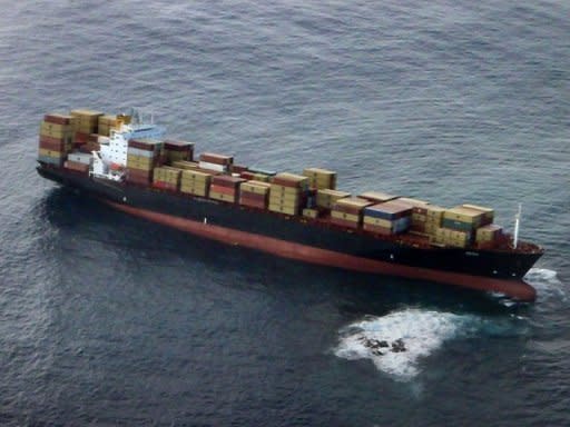 A photo provided by the Bay of Plenty Regional Council photo shows a container ship stranded on a reef off New Zealand's North Island. With the official Metservice forecasting deteriorating conditions from Monday afternoon, the race to remove heavy fuel oil from the 47,000-tonne vessel Rena has taken on added urgency