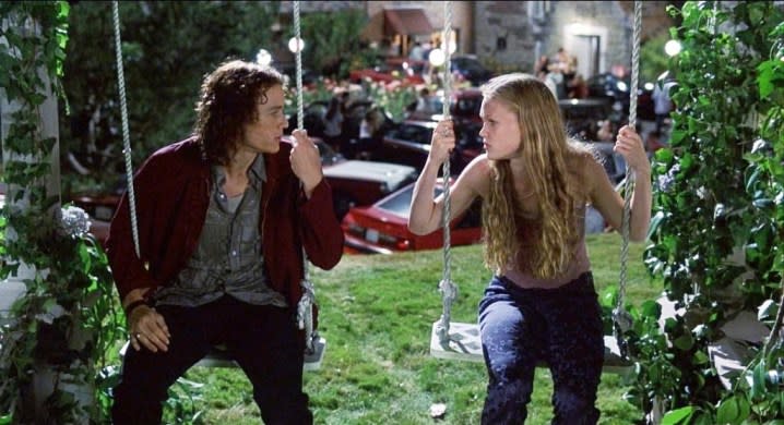 Two people sit on swings in 10 Things I Hate About You.