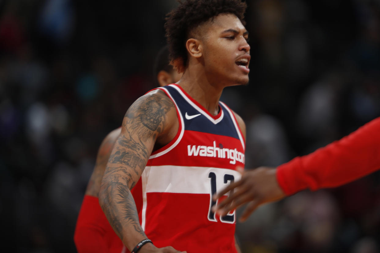 Washington Wizards forward Kelly Oubre Jr. appeared to throw punches and hit teammate John Wall and Warriors’ Klay Thompson. (AP)