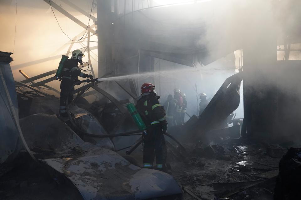 Firefighters put out a fire after Russian attack in Kharkiv over the weekend. At least 14 were killed in the strike (Copyright 2024 The Associated Press. All rights reserved)